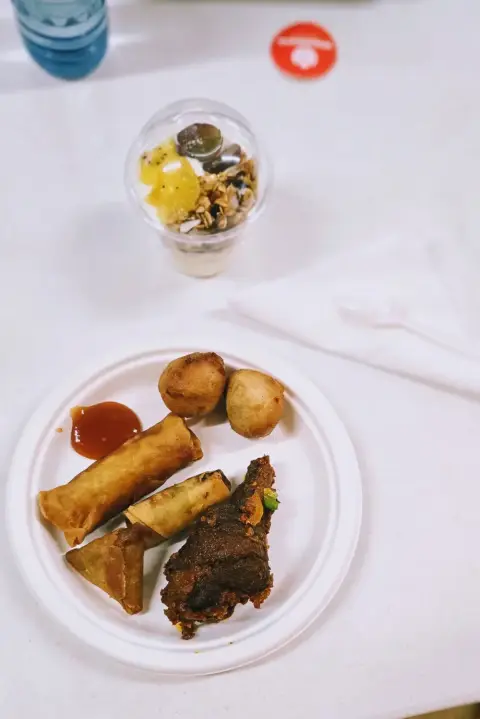 A plate of spicy chicken and small chops at a Nigerian party